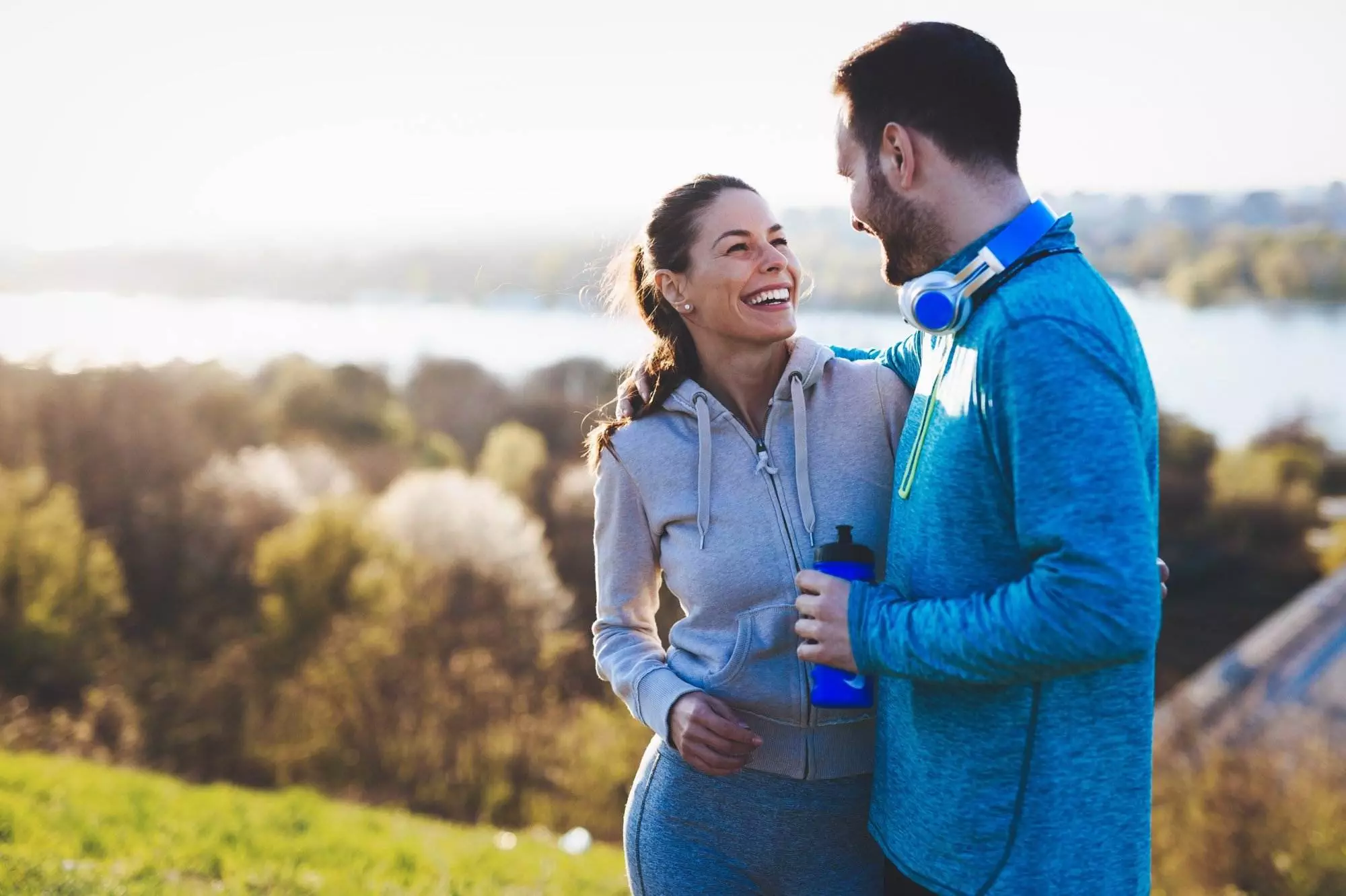 Couple in sportswear enjoying outdoor exercise together