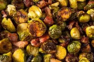 Roasted brussels sprouts with crispy bacon pieces.