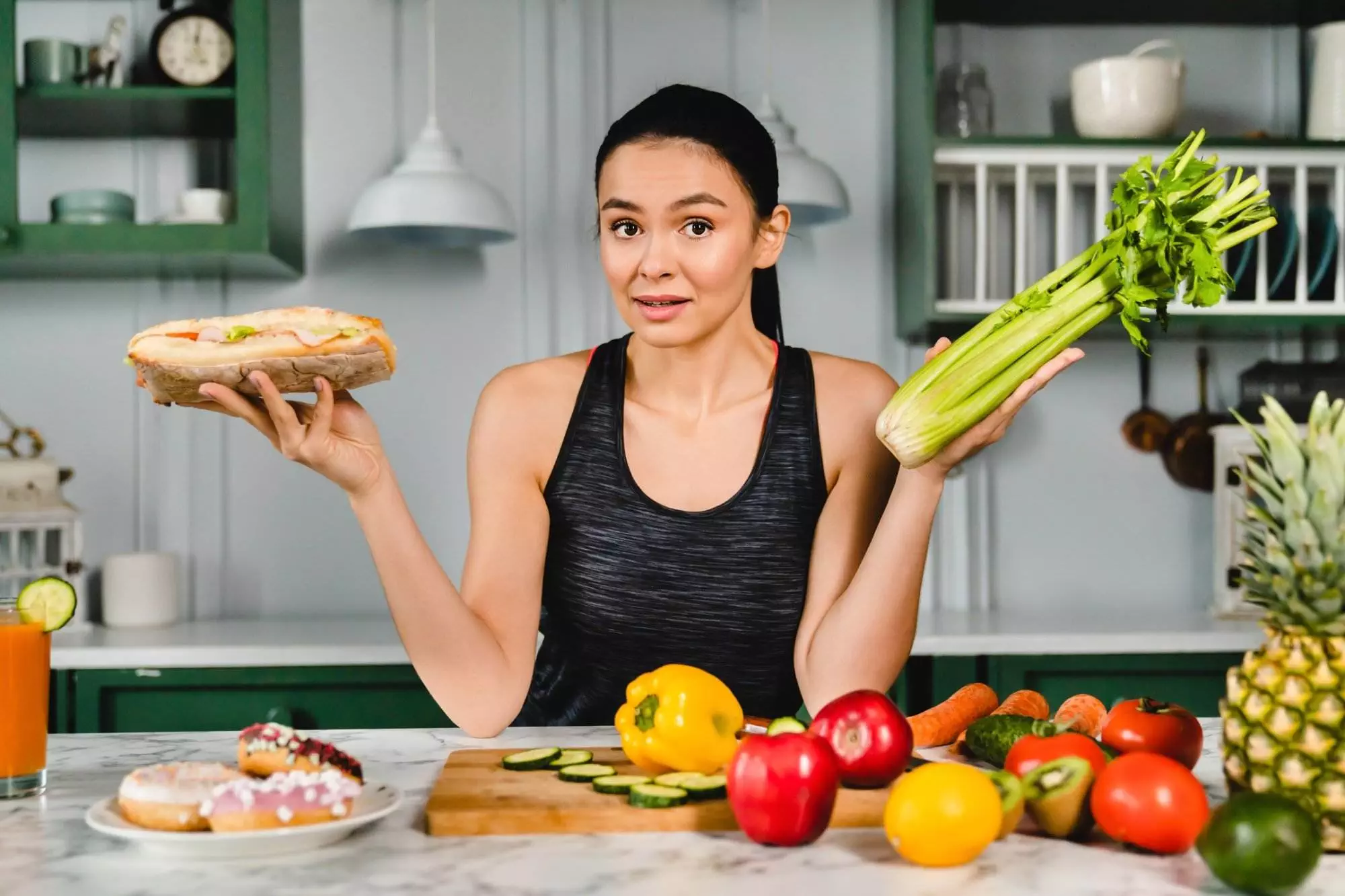 Woman choosing between sandwich and celery, healthy eating concept.