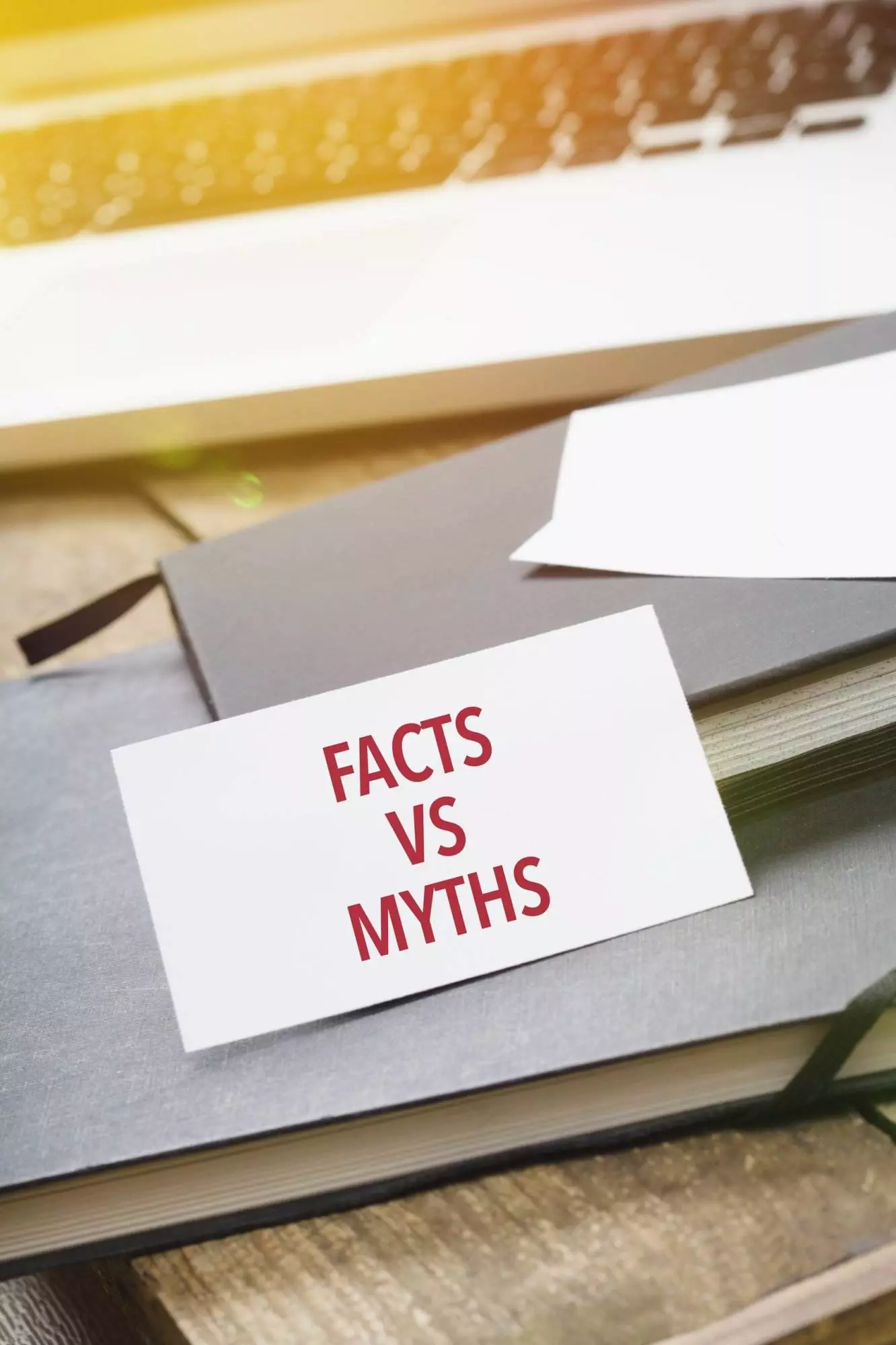 Facts vs Myths card on open book.