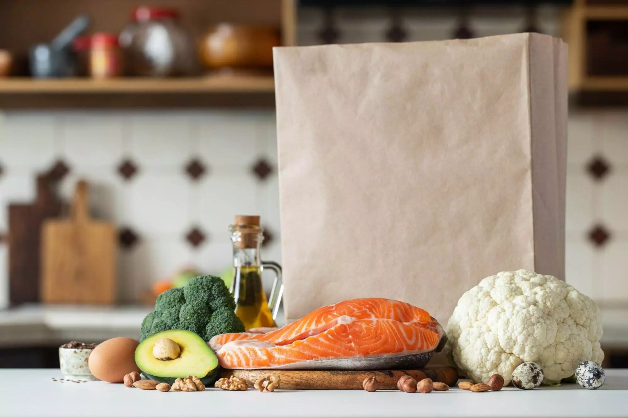 Healthy grocery items with fresh salmon and vegetables.