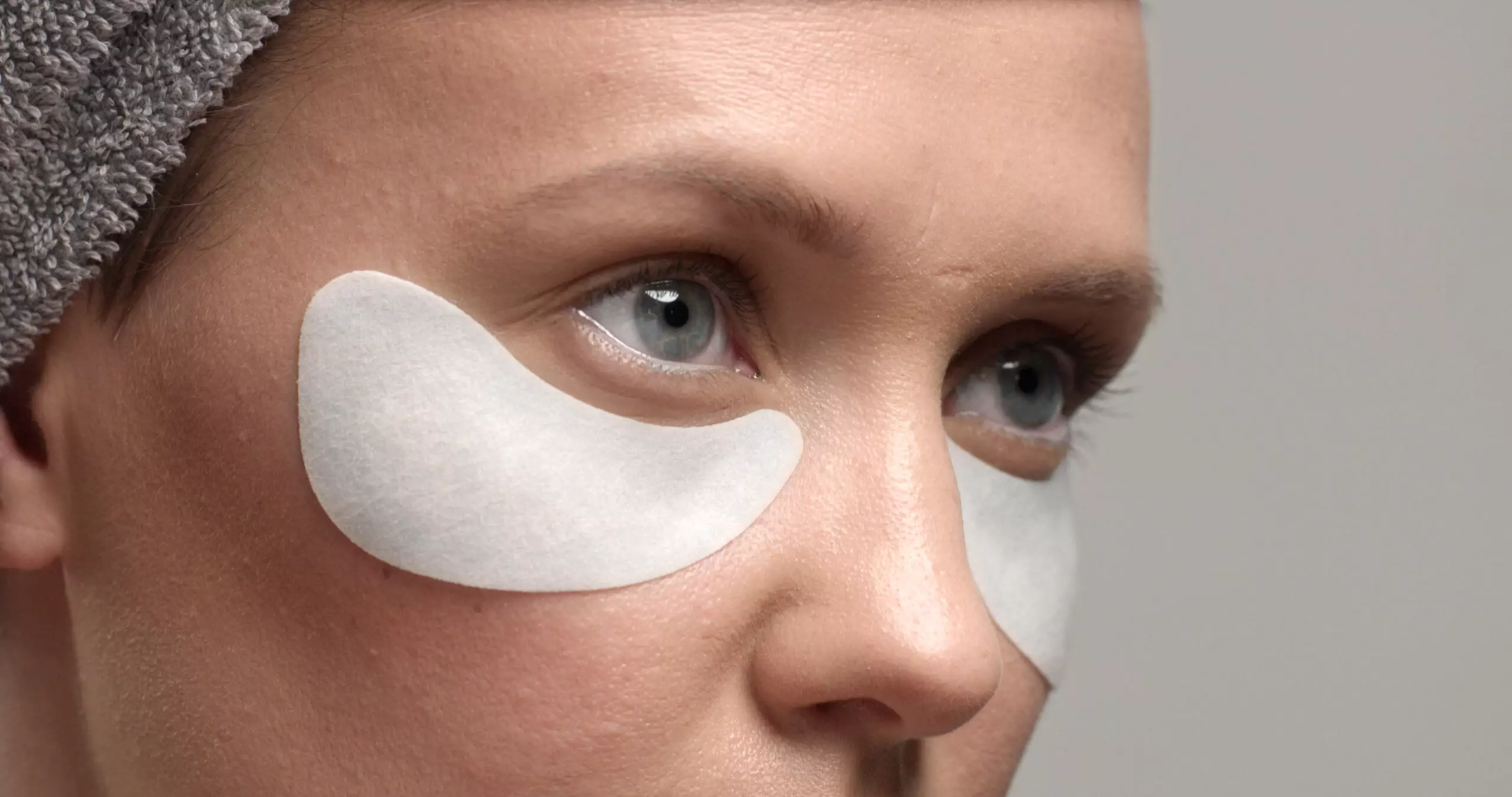 Person with under-eye skincare patches.